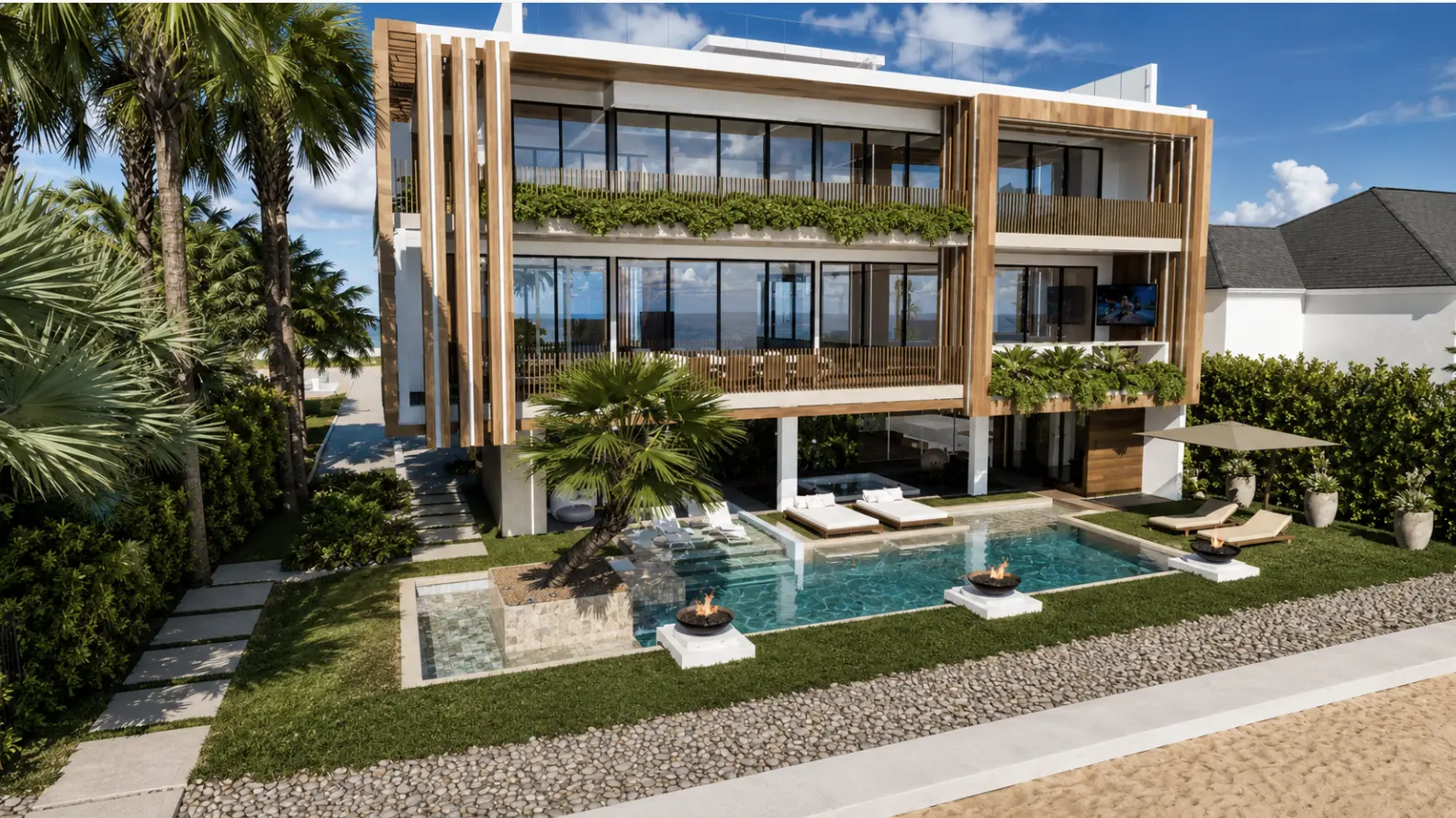 Aerial view of the residence with beach and coastal landscaping